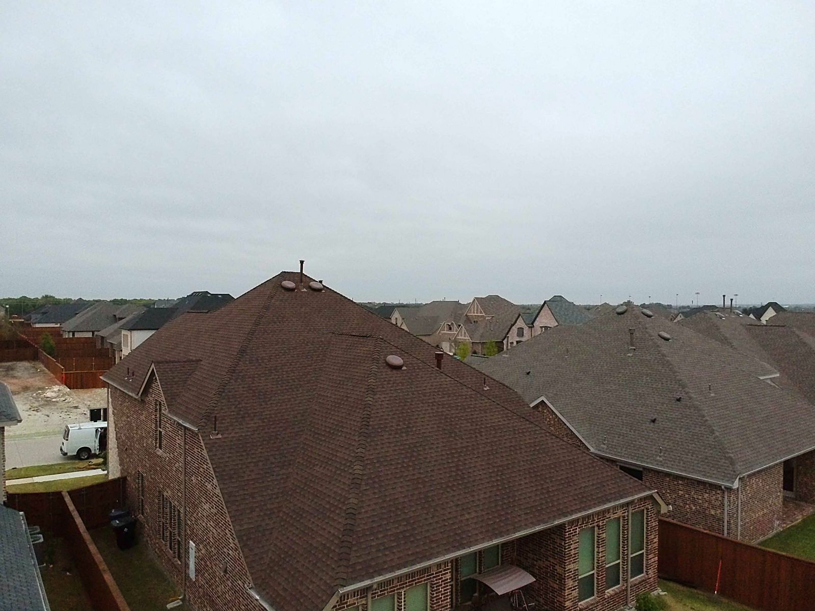 A home with a new Barkwood shingle roof by Reveles Roofing