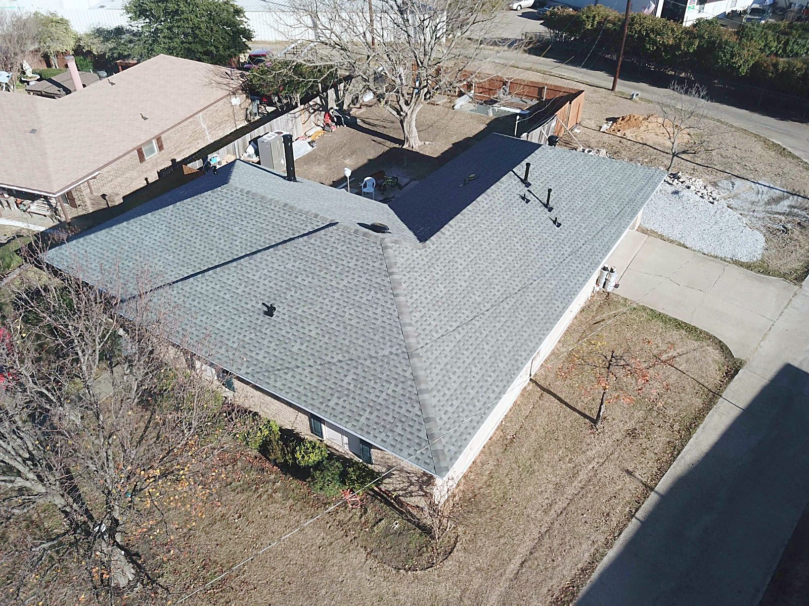 Two-story home with a new Slate shingle roof seen from above